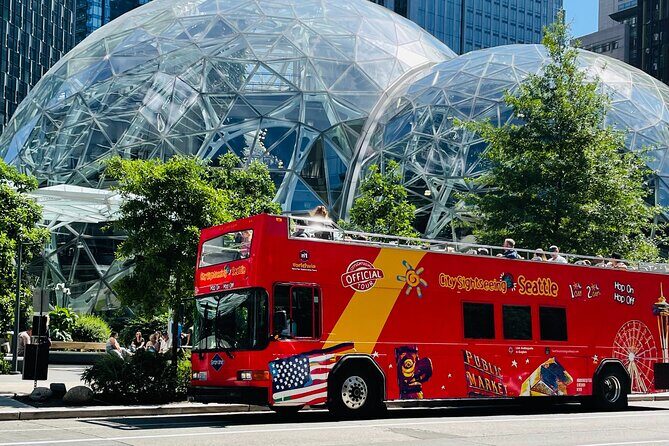 Seattle Sightseeing Scenic Guided Tour and Hop On Hop Off Pass - Alaskan Way waterfront stretch: piers, hotels, and cruise-terminal energy